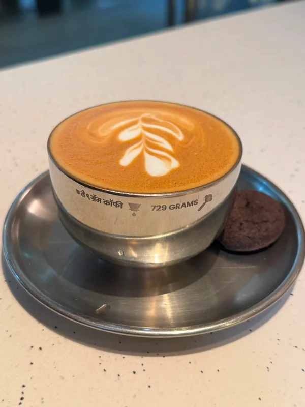 Latte art in a metal cup